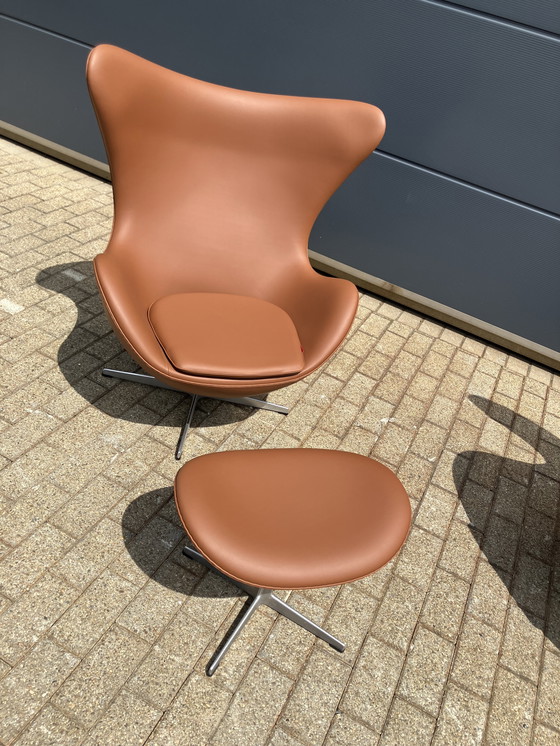 Image 1 of 2x Fritz Hansen Egg Chair + Ottoman en cuir Cognac NEUF !!!