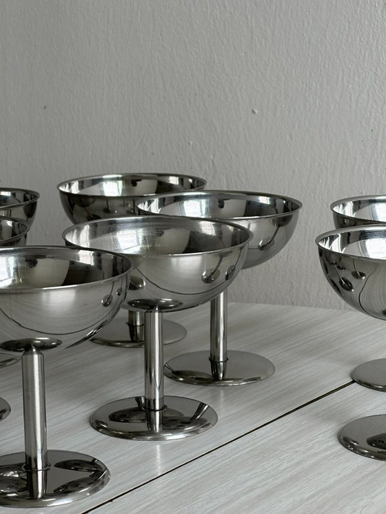 Image 1 of 8 bowls on stainless steel stand