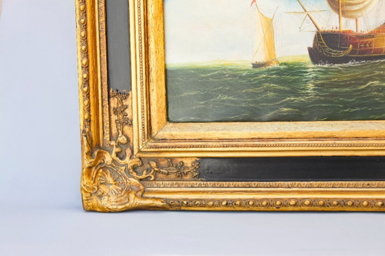 Image 1 of Tableau ancien représentant un navire en mer. Cadre baroque d'origine.