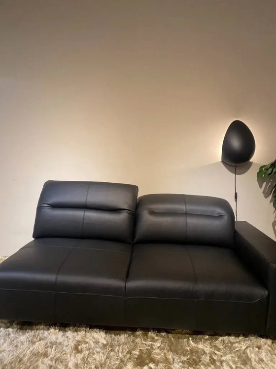 Image 1 of Fauteuil long HAMPTON en cuir noir de BOCONCEPT, de 4 793 € à 1 935 €.