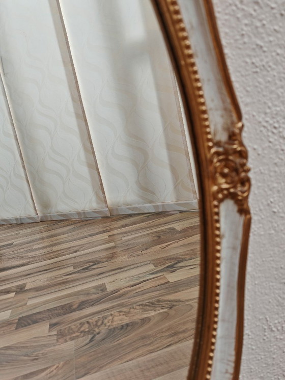 Image 1 of Oval mirror with wooden frame, white, gold from an estate