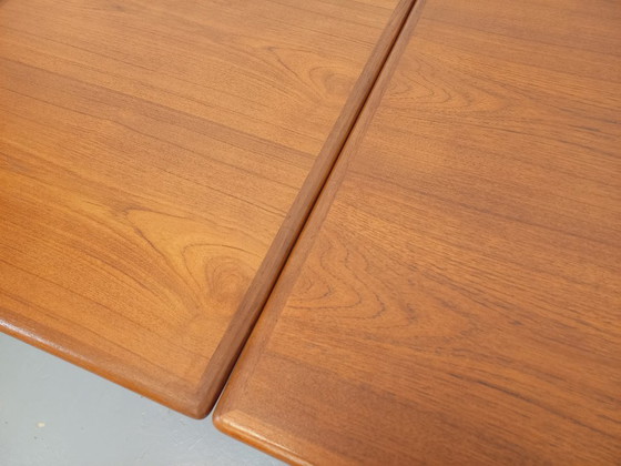 Image 1 of Vintage Scandinavian rectangular dining table by Ejvind A. Johansson from the 50s and 60s in teak with integrated extensions