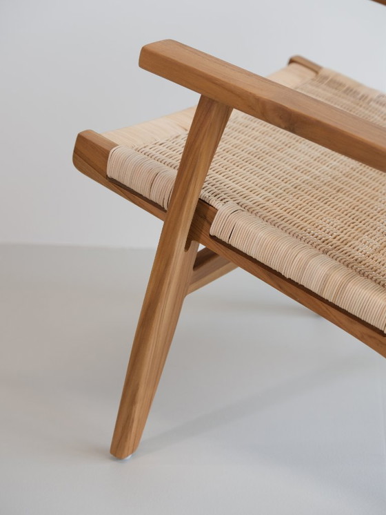 Image 1 of Poltrona lounge Valbona realizzata in teak massello e rattan intrecciato a mano.