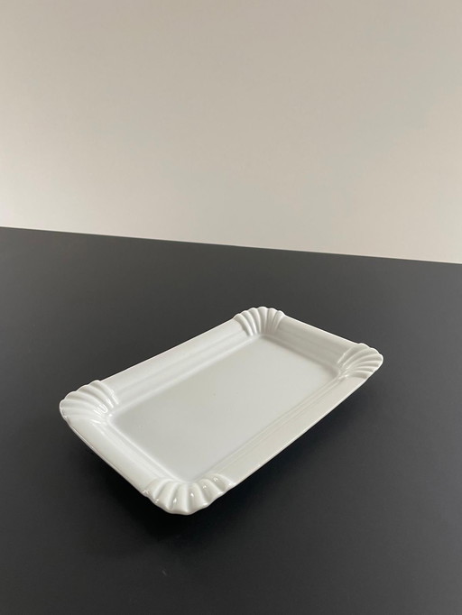 Plate Of White Ceramic In The Shape Of Paper Plate