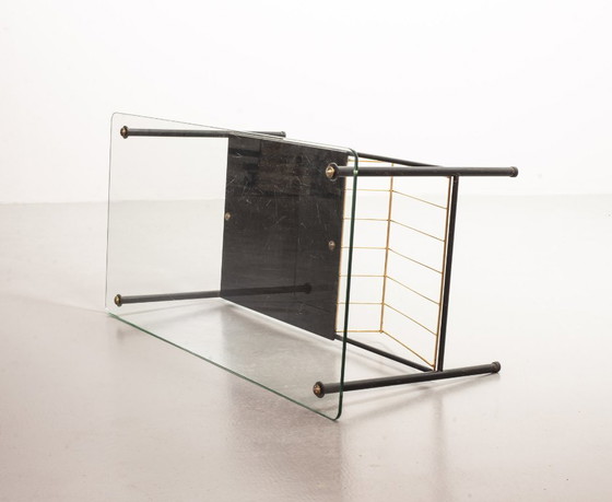 Image 1 of Mid-Century Pierre Guariche Glass Coffee / Side Table for Airborne in Black Steel with Brass Magazine Holder. France, 1950s. 