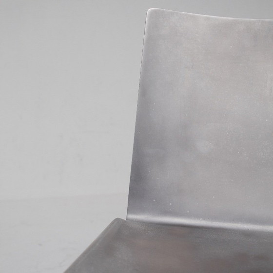 Image 1 of Metalen stoel en bijzettafelset van Xavier Lust