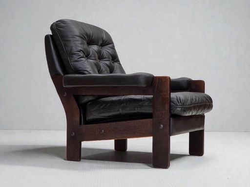 Deense fauteuil uit de jaren 70, bruin meubelleer, eikenhout.