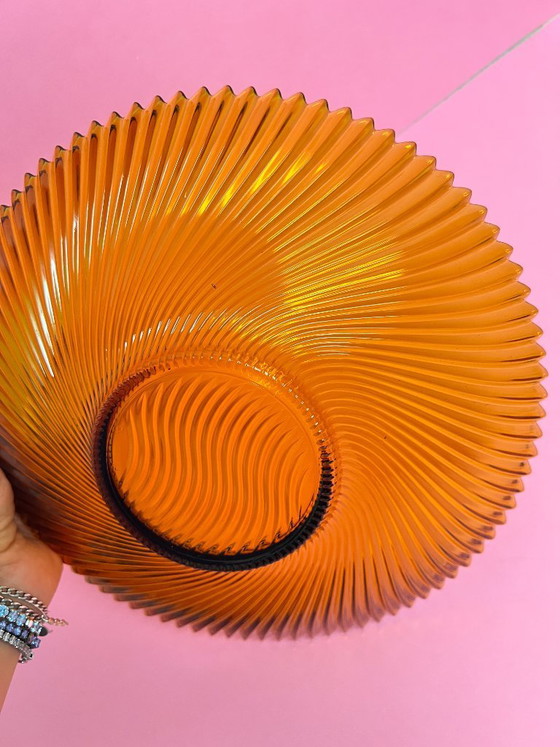 Image 1 of Vintage 70s swirl amber glass amber sunburst fruit bowl sawtooth edge orange
