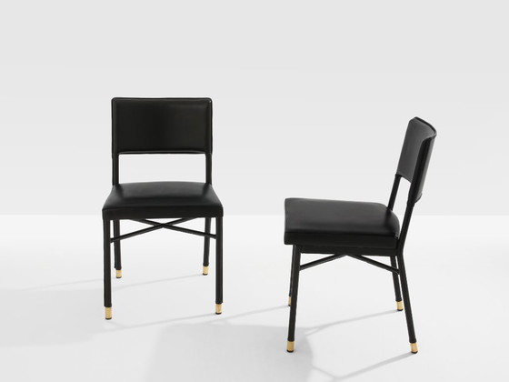 Image 1 of Jacques Quinet paar leren bijzettafels met zadelstiksel en messing details, 1950