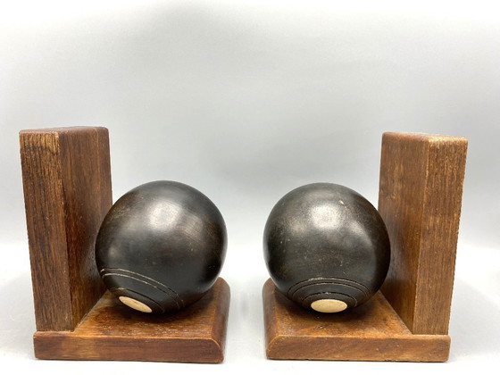 Image 1 of Vintage Lawn Bowl Boekensteunen – Houten Bookends met Zwarte Bowls – Sport Deco – Stoere Man Cave Decor – Uniek Cadeau