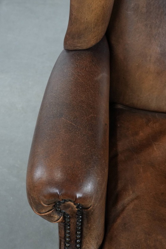 Image 1 of Comfortable vintage sheepskin wing chair with character