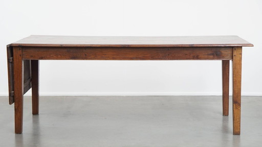 Table de salle à manger ancienne en chêne du début des années 1900 avec plateau rabattable d'un côté