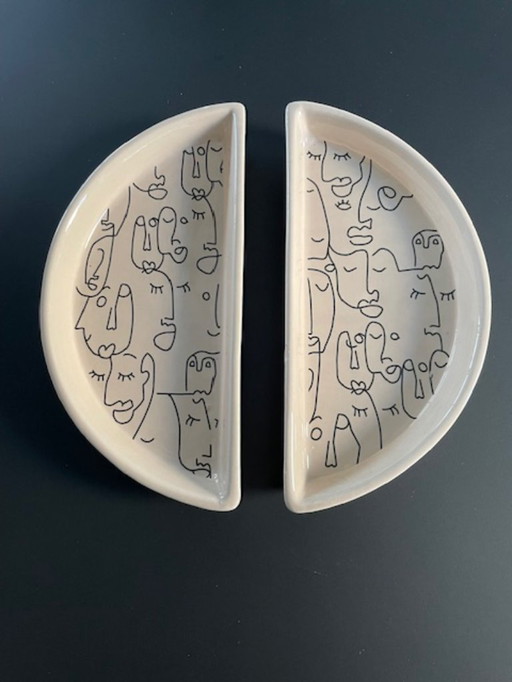 Artistieke set halve bordjes lijntekening