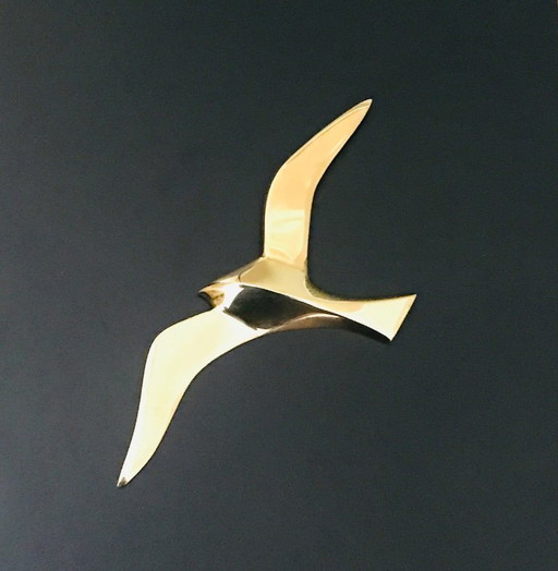 Geometric swallow gilded brass