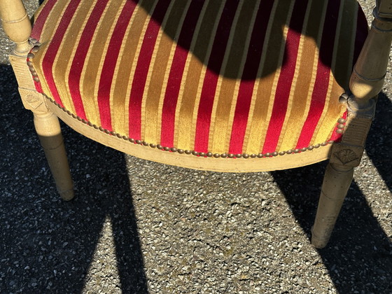 Image 1 of Louis XVI cabrioletfauteuil - Gepatineerd hout en gestreept fluweel