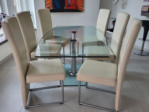Dining room table glass + 6 chairs cream/white leather. Brand Rolf Benz price 850,00€.