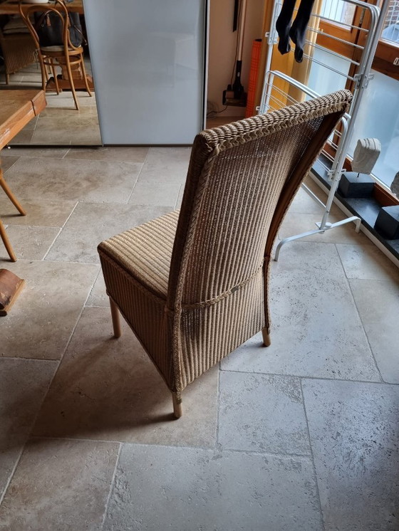 Image 1 of monastery table + 6 wicker chairs