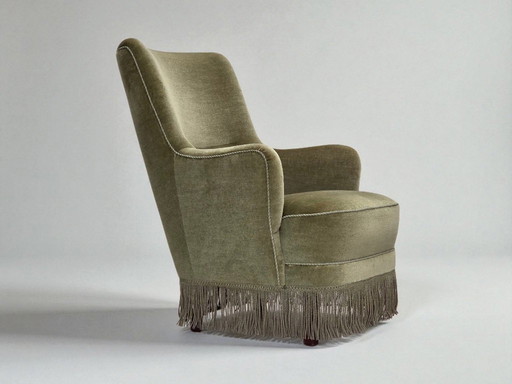 Poltrona danese con schienale alto, anni '70, rivestimento in velluto verde.