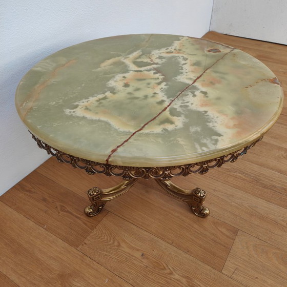 Image 1 of Vintage round Regency coffee table with marble top and brass base
