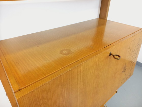 Image 1 of Wall-mounted bookcase with vintage light wood and brass secretary bar, dating from the 1960s