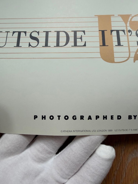 Image 1 of Anton Corbijn, U2 Outside It's America, Photographed by Anton Corbijn, copyright Athena Int.., London 1989, Printed in England