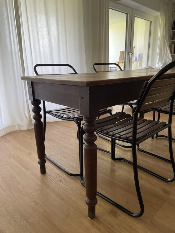 Image 1 of Solid wood dining table + 4 chairs - vintage / industrial style