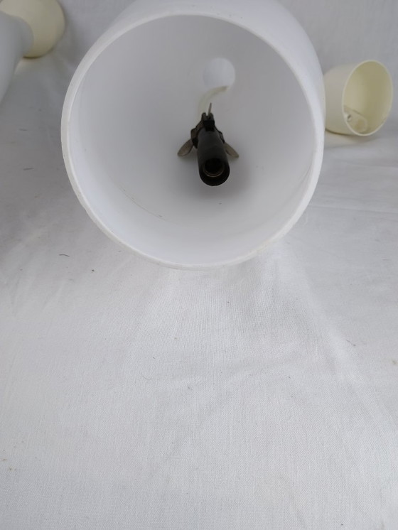 Image 1 of Elegant and timeless, this set of three original Holmegaard glass pendant lamps