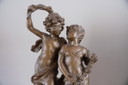 A Gold / Coppery Statue Of A Boy And Girl Young Lovers
