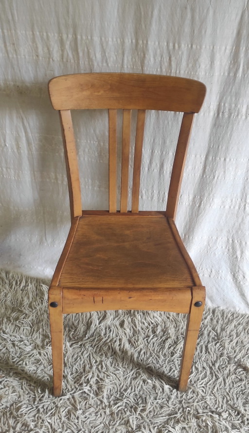 Chaise en bois massif par Stella - années 50/60