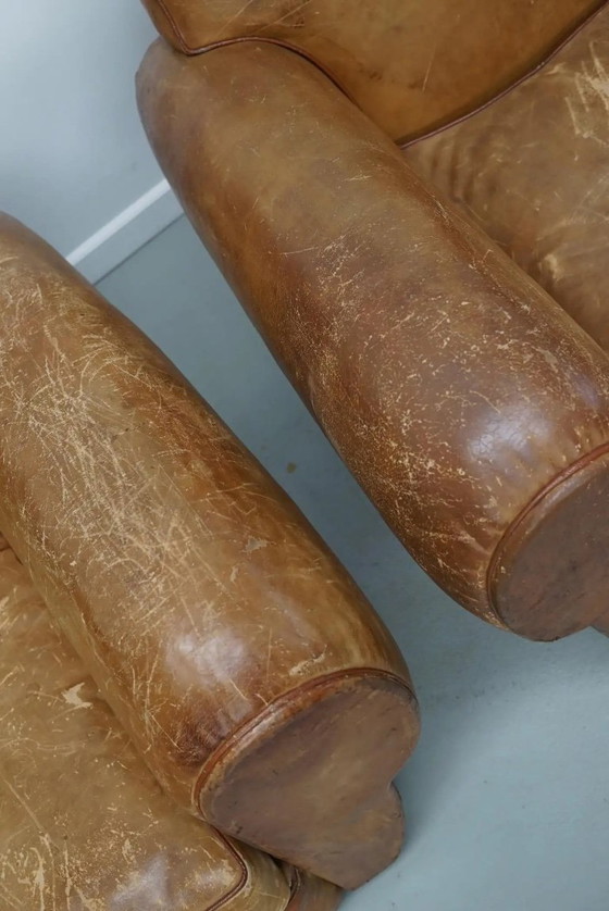 Image 1 of Ein Paar französischer cognacfarbener Ledersessel mit schnurrbartförmigen Rückenlehnen, 1940er Jahre