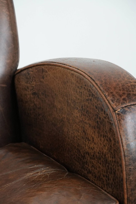 Image 1 of Vintage schapenleren armchair met een ronde vormgeving 