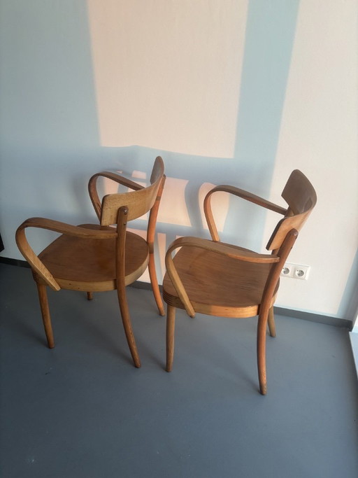 2x wooden vintage chairs with curved design