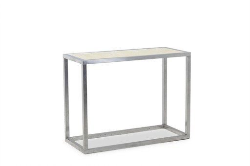Maison Jansen. Console in brushed aluminum with a reverse-painted glass top. 1970