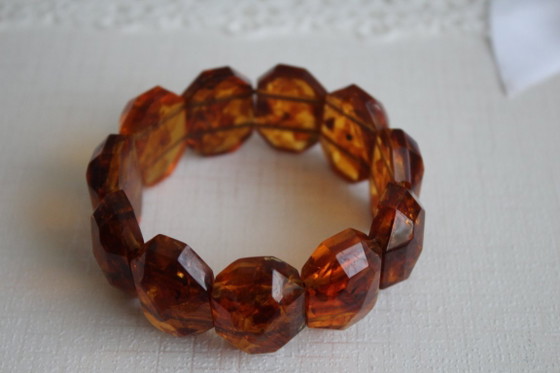 Image 1 of Amber bracelet, intricately cut, 46 grams of honey amber.