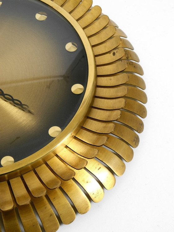 Image 1 of Beautiful original Mid Century Sunburst Atlanta Universe wall clock made of heavy brass with a mechanical seven-day movement
