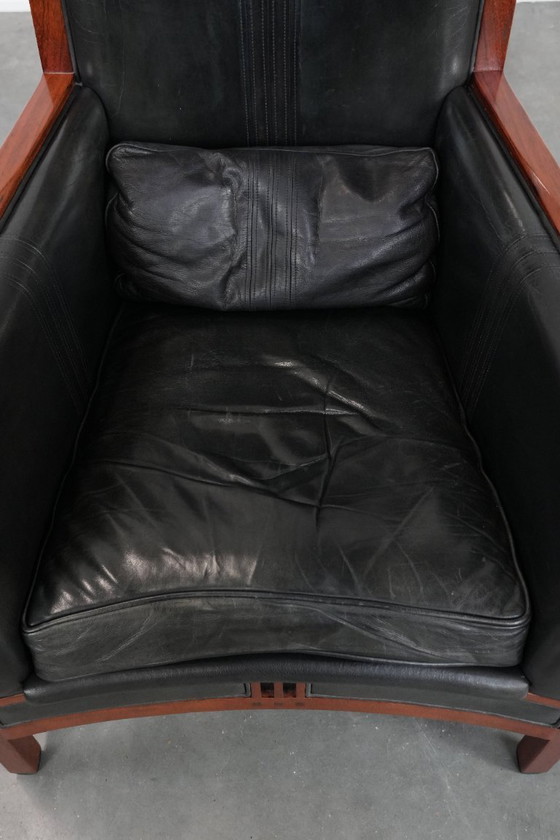 Image 1 of Black cowhide and wooden Art Deco design armchair by Schuitema from the Decoforma series with decorative cushion