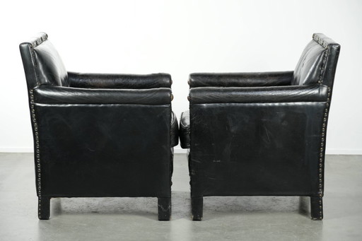 2 x Unique, special, elegant cowhide armchair with leather legs
