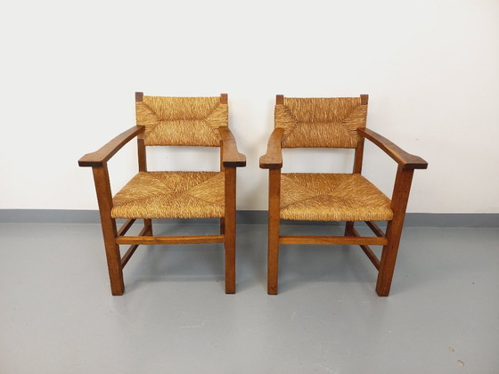 Image 1 of Suite van 2 vintage Brutalistische fauteuils in eiken en stro uit de jaren 60