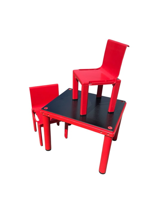 MASAYUKI MATSUKAZE & CENTROKAPPA DESIGN TEAM for Kartell table and two red chairs for children Sistema Scuola