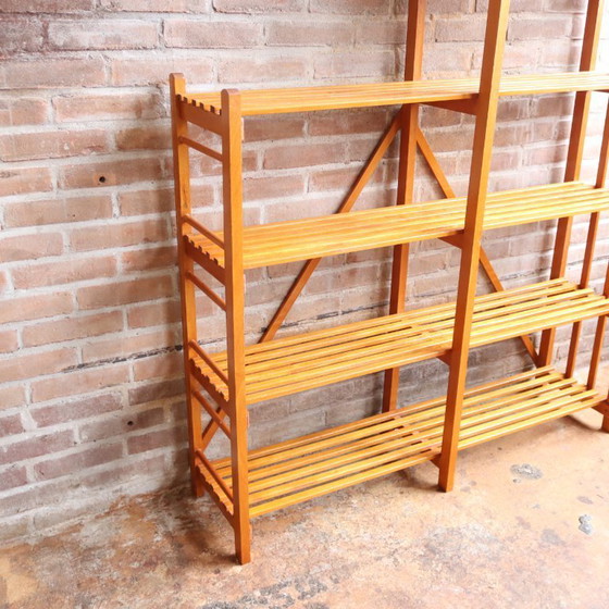 Image 1 of Libreria vintage con ante a doghe aperte, giocattoli e libri