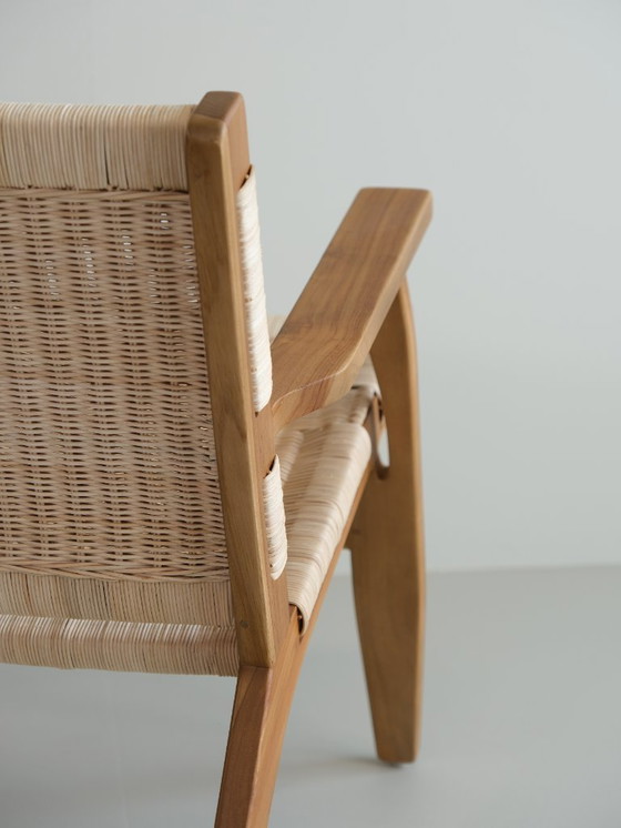 Image 1 of Poltrona lounge Valbona realizzata in teak massello e rattan intrecciato a mano.