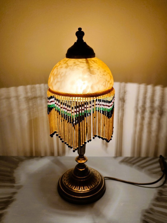 Image 1 of Antieke gouden tafellamp met kwastjes