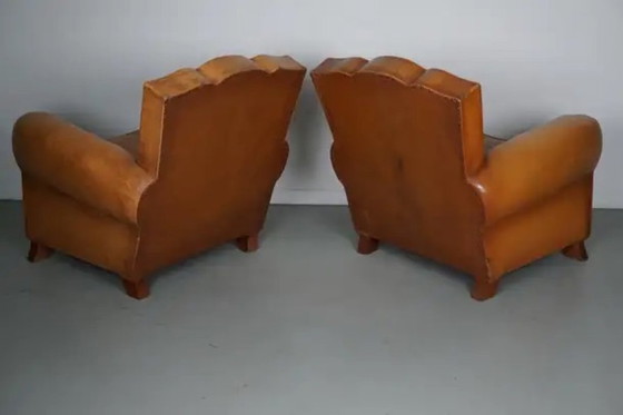 Image 1 of Set Franse cognackleurige leren clubfauteuils met ‘moustache’-rugleuning, jaren 1950