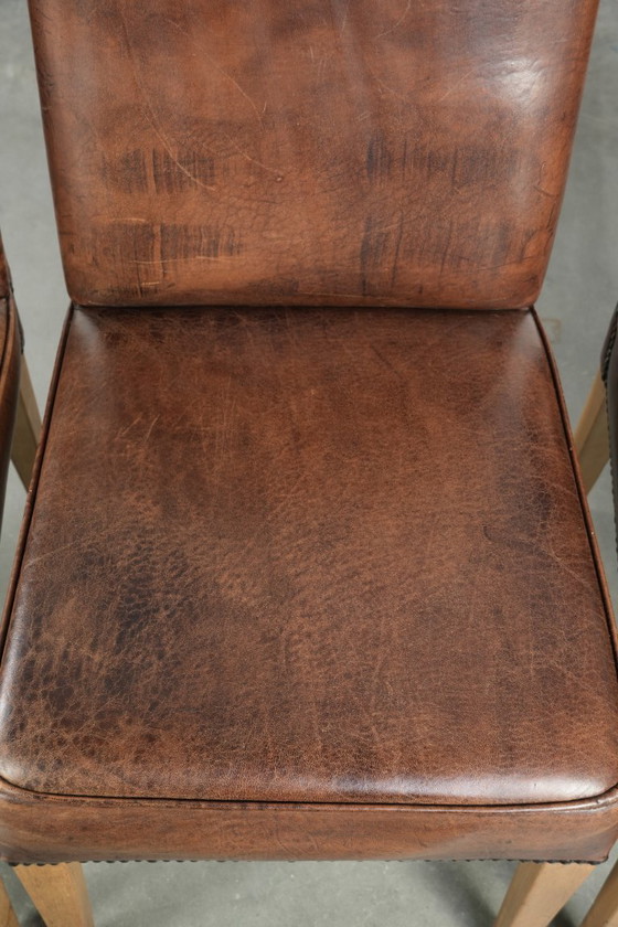 Image 1 of 4 x Vintage eetkamerstoel gemaakt van schapenleer met een hoge rug