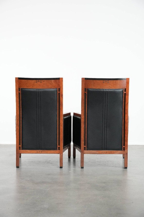 Image 1 of 2 x Black cowhide Art Deco design armchairs with high backs by Schuitema