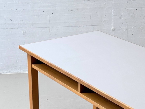 Image 1 of Bureau/werktafel van massief hout met laminaatblad, jaren 50.