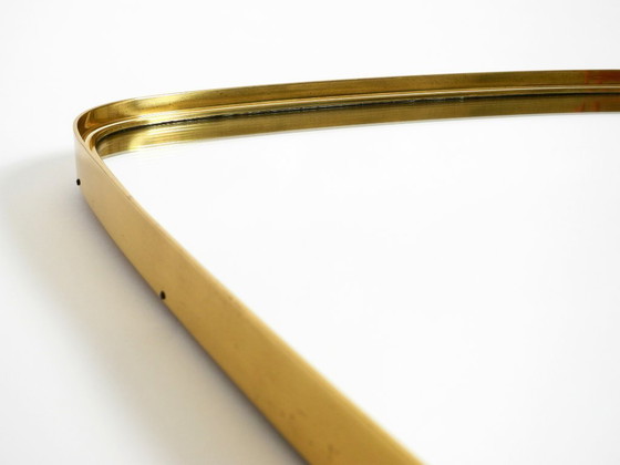 Image 1 of A pair of rare original Mid Century Modern "Münchener Zierspiegel" wall mirrors with heavy brass frames