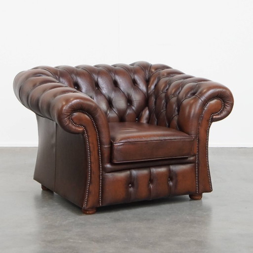 In good condition, cowhide leather chesterfield club chair in English style