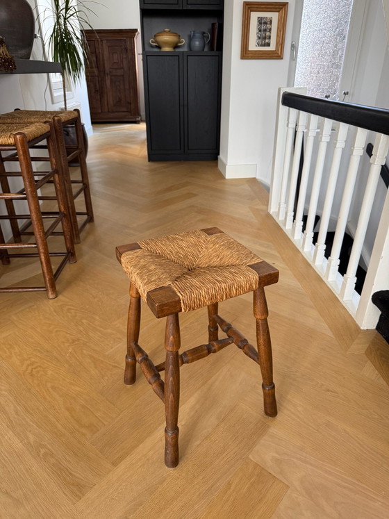 Vintage wooden stool with wicker seat (photo 2 of 5)