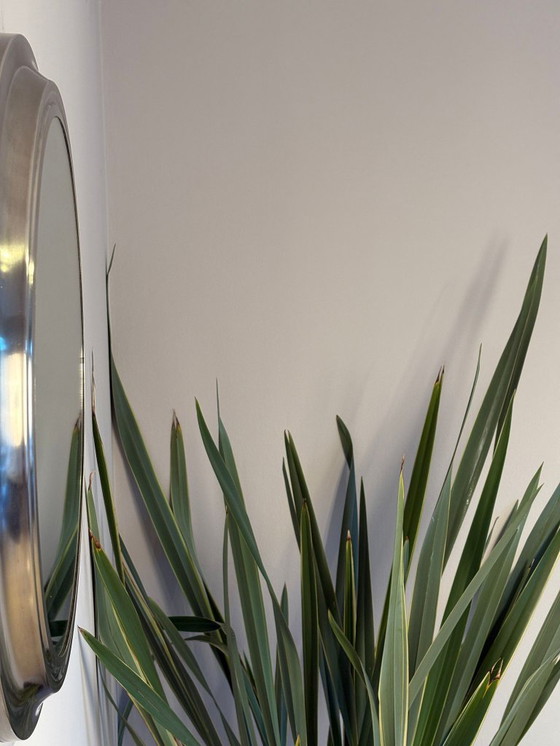 Image 1 of round mirror with metal frame, dating back to the 1970s